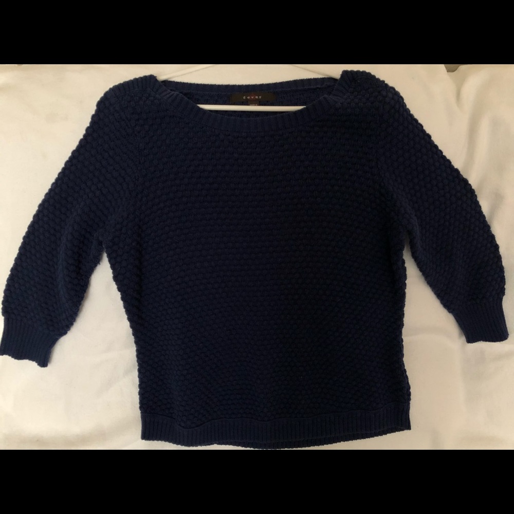 Knitted navy blue sweater.
